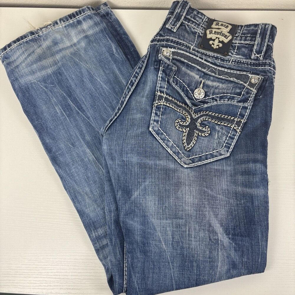 Rock Revival Mens En Bootcut Jean in Medium Indigo Distressed Heavy Stitch 34x32